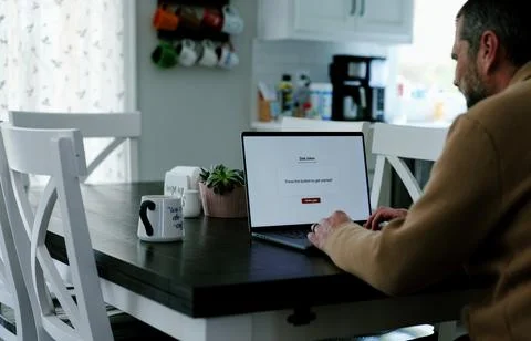 Middle Aged Man Testing Dad Joke Generator Website Stock Photos