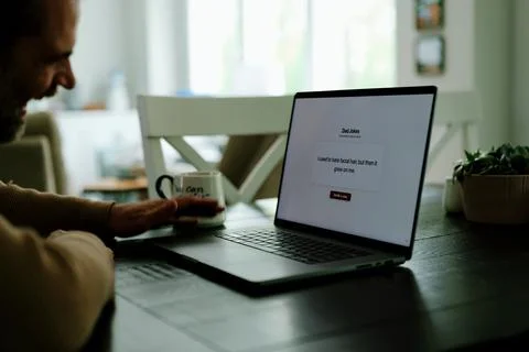 Middle Aged Man Testing Dad Joke Generator Website Stock Photos
