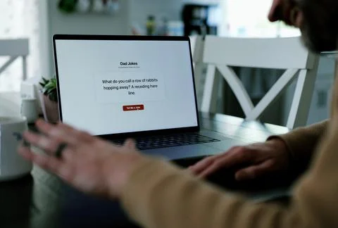 Middle Aged Man Testing Dad Joke Generator Website Stock Photos