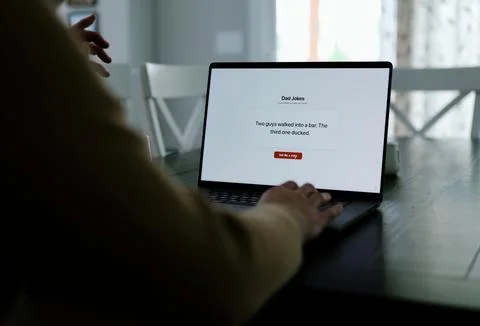 Middle Aged Man Testing Dad Joke Generator Website Stock Photos