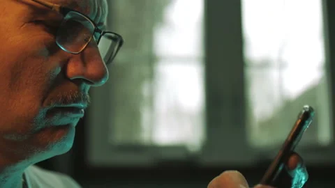 Middle Aged Man Texting and Scrolling Cell Phone Video stock 235948489