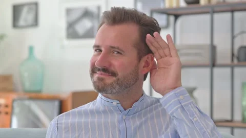 Middle Aged Man trying to Listen Secret Information Stock Footage 287897447