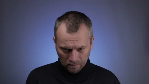 Middle aged man trying to put on his broken glasses. Stock Footage 130758206