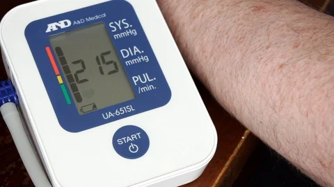Middle aged man using home blood pressure monitor health check, measuring begins Stock Footage 96076752