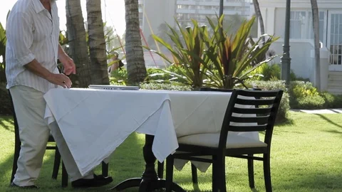 Middle-aged man using a laptop at a table. 스톡 동영상 88370334