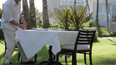 Middle-aged man using a laptop at a table. Stock Footage 88370342