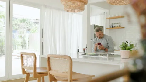 Middle-aged man using mobile phone or smartphone Stock Footage 210744571