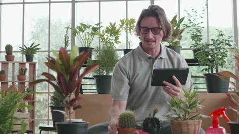 A middle-aged man is using a tablet computer at a video conference. Stock Footage 140340019