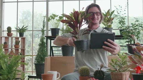 A middle-aged man is using a tablet computer at a video conference. Stock Footage 140340044