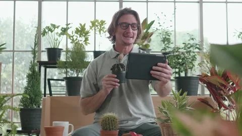 A middle-aged man is using a tablet computer at a video conference. Stock Footage 141126424