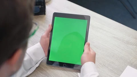 Middle Aged Man Using Tablet with Chroma Key Green Screen Stock Footage 242592008