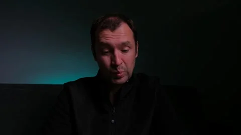 Middle-aged man with various facial expressions looking directly at the camera Stock Footage 329923247