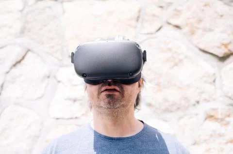 Middle aged man with virtual reality glasses Stock Photos
