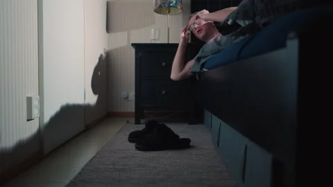 A middle-aged man waking up early before sunrise to start his day in Finland Stock Footage 296909149