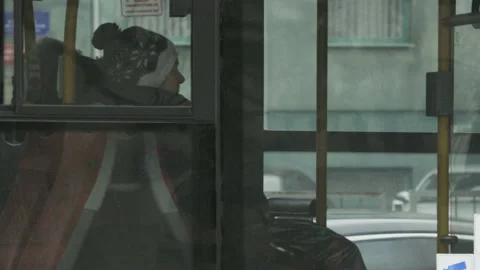 Middle-aged Man Walking into a Bus. The Bus Moves Off Stock Footage 113411434