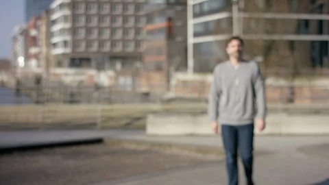 Middle aged man walking towards the camera in urban hamburg city. Stock Footage 97815230