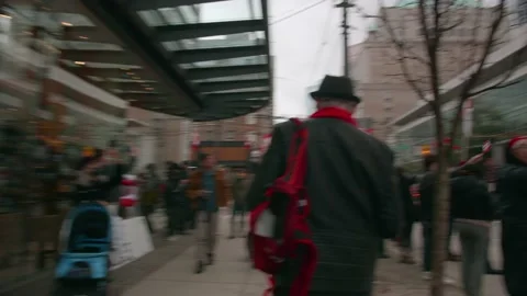 Middle aged man walks through crowd during Covid-19 mandate protest Video stock 171652270
