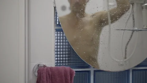 Middle-aged man washes in the shower. man in front Stock Footage 121516876