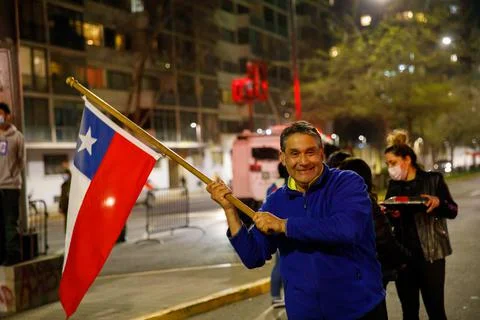 Middle aged man waves his Flag to celebrate rejection of the new constitution Stock Photos