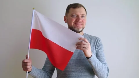 Middle aged man is waving the flag of Poland. Stock Footage 240108381