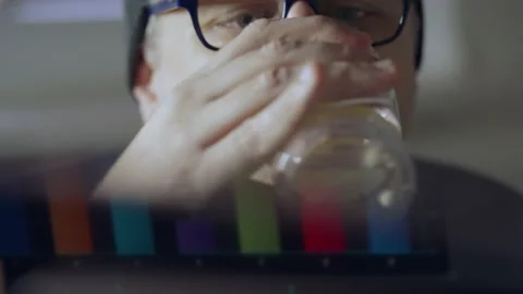 Middle-aged man working on a computer in the shadows Stock-Footage 167169904