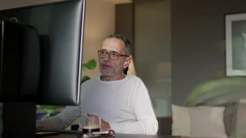 Middle-aged man working from home Stock Footage 220263699