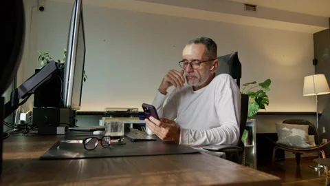 Middle-aged man working from home Stock Footage 220454015