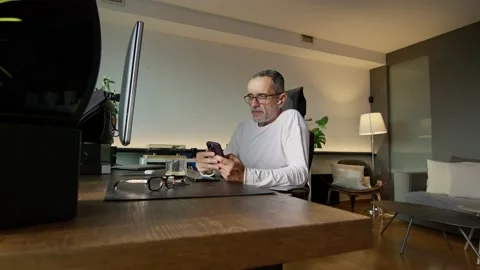 Middle-aged man working from home Stock Footage 220465289