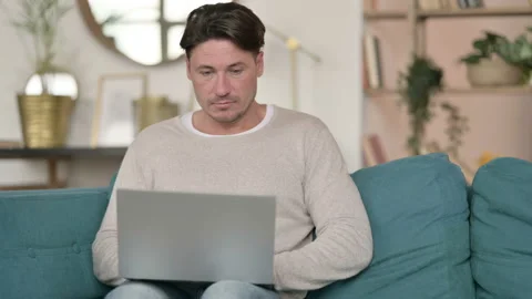 Middle Aged Man working on Laptop, at Home 스톡 동영상 142376966