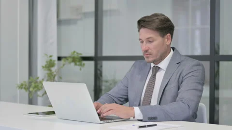 Middle Aged Man Working on Laptop in Office Video stock 162844069