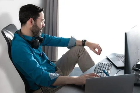 Middle-aged man working in an office. Cheerful Looking out the window Stock Photos