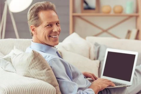 Middle aged man working Foto stock