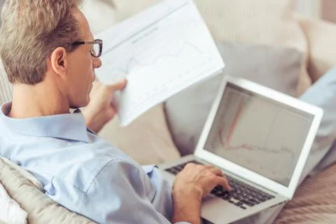 Middle aged man working Stock Photos