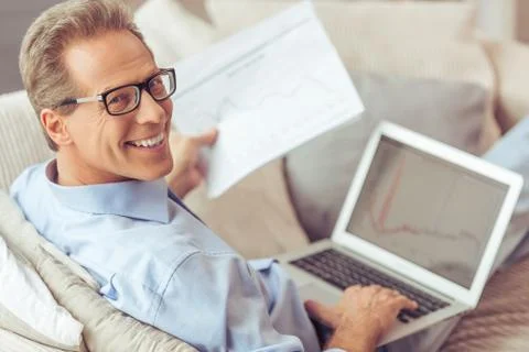 Middle aged man working Foto stock