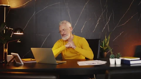 Middle-aged manager feeling annoyed while working on a laptop, software bugs Video stock 340902736