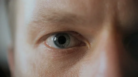 Middle-aged man's blue-gray eye. Close-up. Macro.European Stock Footage 116657268