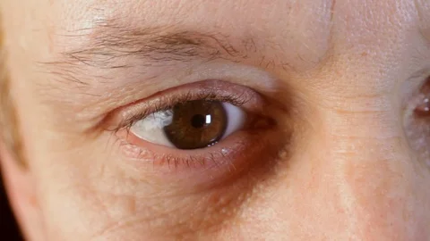 Middle-aged man's brown eye. Close-up. Macro.European Stock Footage 116653494