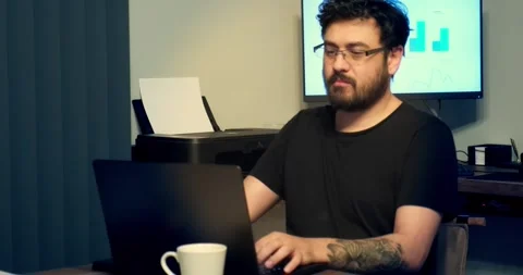 Middle-aged messy businessman working with his laptop in office environment Vídeos de archivo 306108694