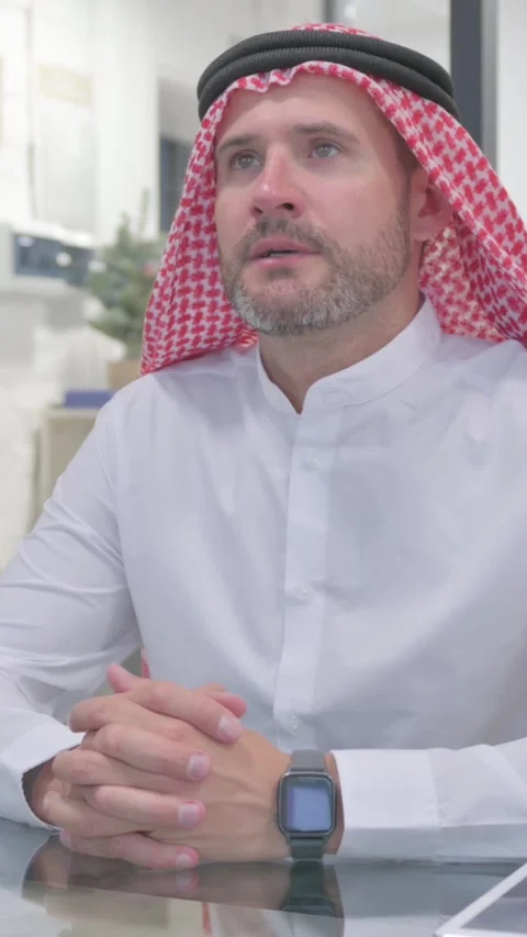 Middle Aged Muslim Man Checking Time on Watch while Waiting at Work, vertical Stock Footage 324777563
