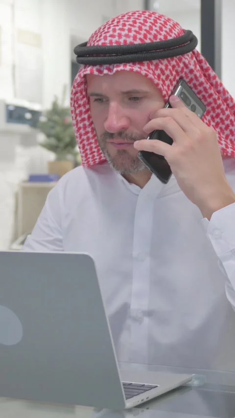 Middle Aged Muslim Man Talking on Phone with Customer, Negotiation, vertical Stock Footage 324777461