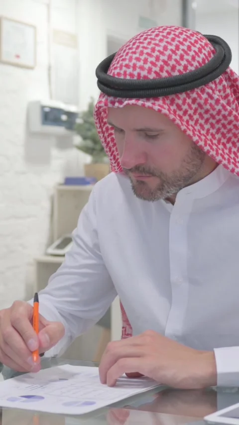 Middle Aged Muslim Man Working on Documents in Office, vertical video Stock-Footage 324777509