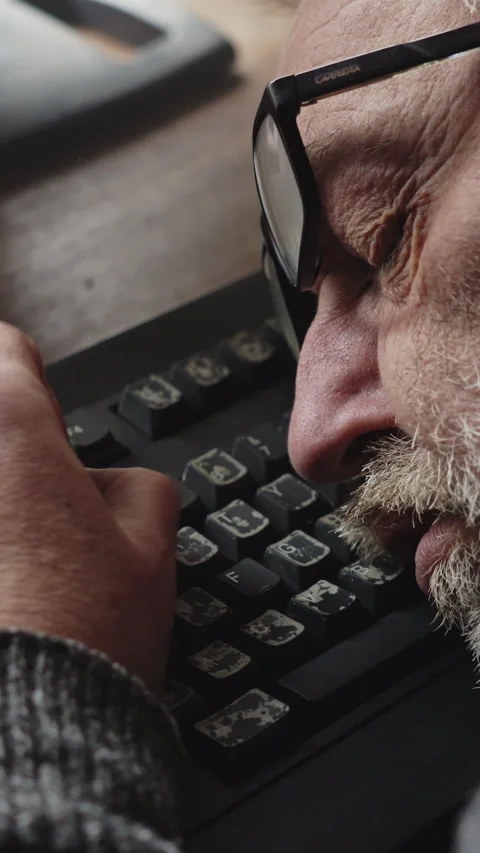 Middle Aged Programmer Asleep at Keyboard After Working Through the Night Video stock 337762632