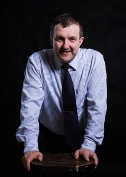 Middle aged solid man dressed in shirt studio portrait Stock Photos