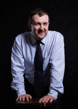 Middle aged solid man dressed in shirt studio portrait Stock Photos