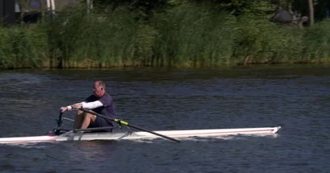 Middle aged sportive man rowing a boat at Amsterdam river, Netherlands Stock Footage 91608146