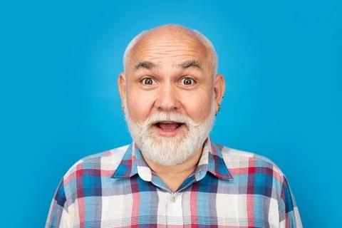 Middle aged surprised man on studio isolated background. Close up portrait of Stock Photos