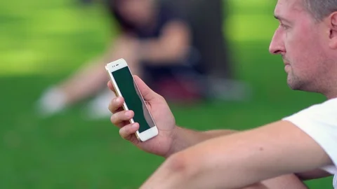 Middle-aged unshaven man using a mobile Stock-Footage 115073063