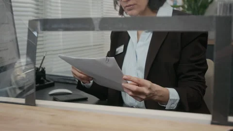 Middle-aged Visa Center Agent Checking Visa Application Documents Stock Footage 331506657