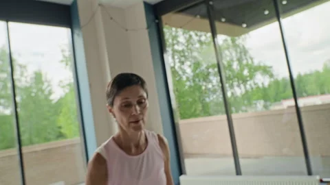 Middle-aged Woman Doing Active Dance Fitness Workout in Studio Stock Footage 339848839