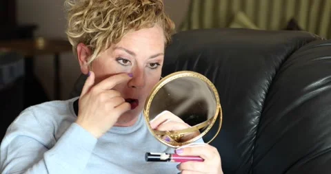 Middle aged woman looking at mirror 3 Stock Footage 150241401